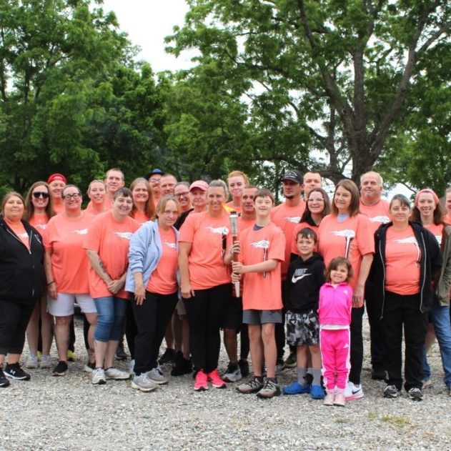 Photo by Katey Wesley The Special Olympics torch runners gathered at a parking lot near Licking High School to begin the Licking leg of their run.