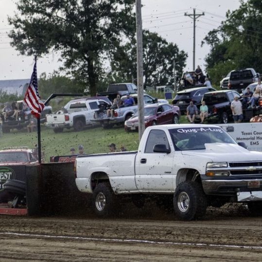 Photo by Katey Wesley The Chug-A-Lug kicked up some dirt pulling on the north track Saturday.