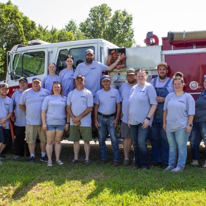Photo by Shari Harris The Raymondville Volunteer Fire Department, from left: Pat Jones, firefighter; Jasper Clark; Tony Bishop, probationary firefighter; Steve Wilkinson, Fire Captain; Anabella Jackson (top); Jennifer Jackson, Fire Captain and Board Sec/Treas.; Sara Holden (top), Mike Jackson, Fire Chief; Brandon Holden (top), firefighter; Dave Scantlin, Board President; Denver Culley, firefighter; Savannah Hathaway, auxiliary member; Travis Hathaway, firefighter and Board Member; Tori Porter, auxiliary member; and Tracy Holden, auxiliary member. Not present for the photo were fire captains Dan Mills and Larry Wildhaber (also a board member); firefighters Jacob Wallace and Anthony Teem; probationary firefighters Tanner Enfield, Pablo Islas, Jessie Cannatella and Zeb Whitehouse; and board member Terra Culley.