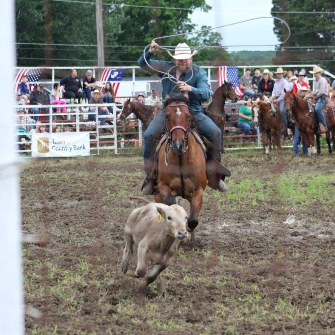 Photo by Shari Harris Ropers thought they had mud to deal with Friday, but Saturday evening saw even more wet muck flying in the arena.