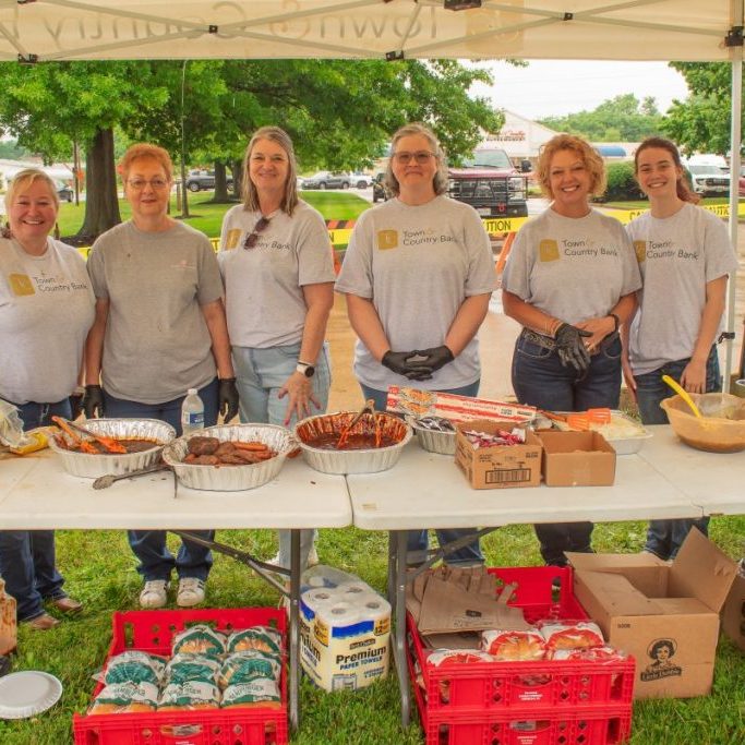 Photo by Shari Harris After the rain stopped Friday at midday, this group of associates from Town & Country Bank and Town & Country Insurance served many customers who defied the weather to attend the kickoff event of Rodeo Weekend in Licking. Barbecued hot dogs and hamburgers were on the menu at this Customer Appreciation Day, and they were delicious!