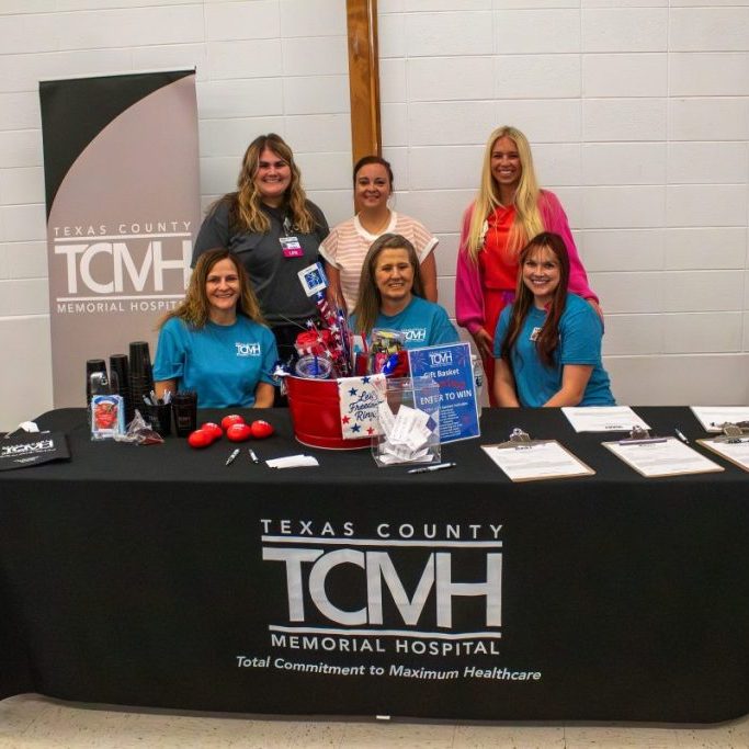 Photo by Shari Harris These TCMH and TCMH Family Clinic - Licking staff were first to greet attendees of the first annual Community Health Fair. From left, seated: Helania Wulff, Director of Public Relations, Marketing, & Physician Recruitment, Anita Quick, Controller, and Katelynn Atchley, Director of Human Resources; and standing: Whitnie Shepherd, LPN-IV, Emily Wiseman, FNP, and Shelby Ellison, RN, Case Management. 